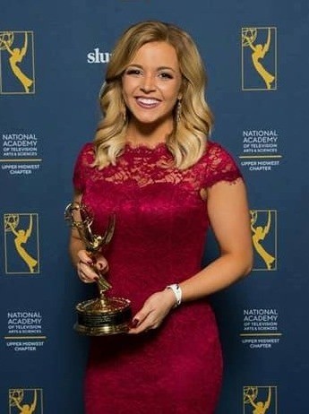 Sarah holding her Emmy at the Upper Midwest Emmy Awards